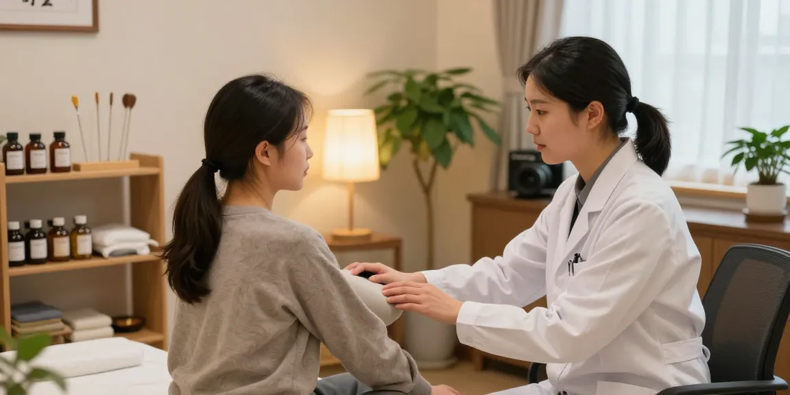 Compassionate practitioner at 수원한의원 assessing patient in calming treatment room.